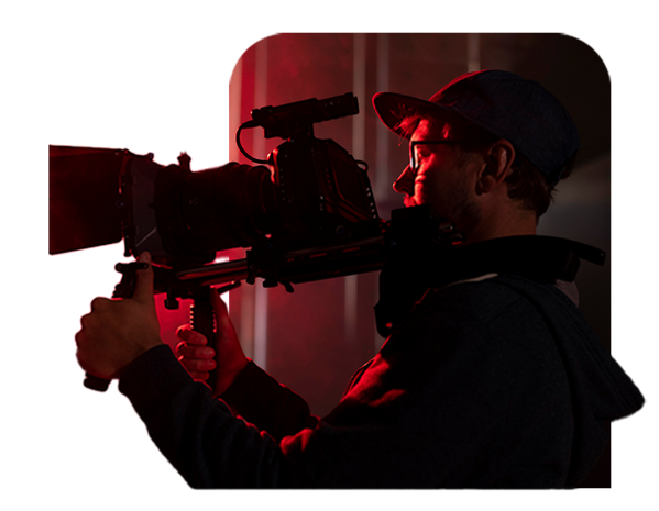 A filmmaker operating a camera.